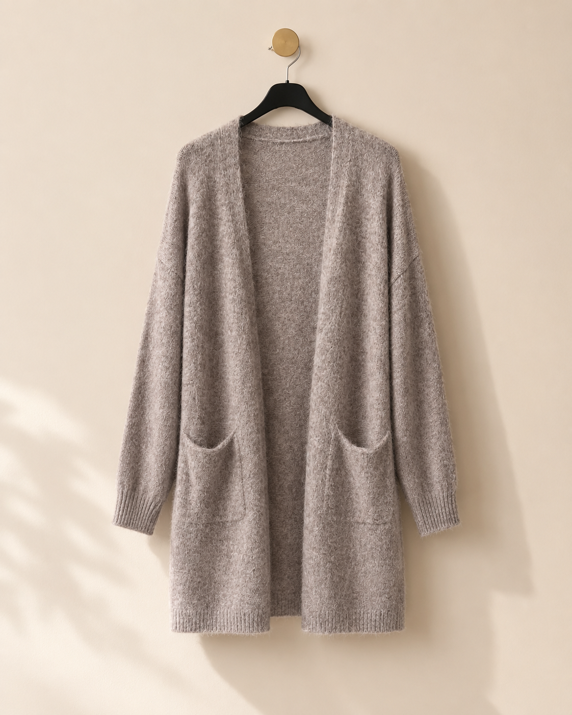 Lång stickad kofta med fickor – Mirelle Design